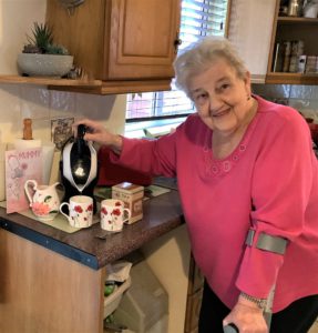 Elderly woman making tea with her Uccello tilt to pour kettle